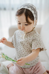 avauma breeze garden baby clothing set oatberry cream, baby girl wearing floral short sleeve top and pastel pink shorts, cute and comfy summer outfit